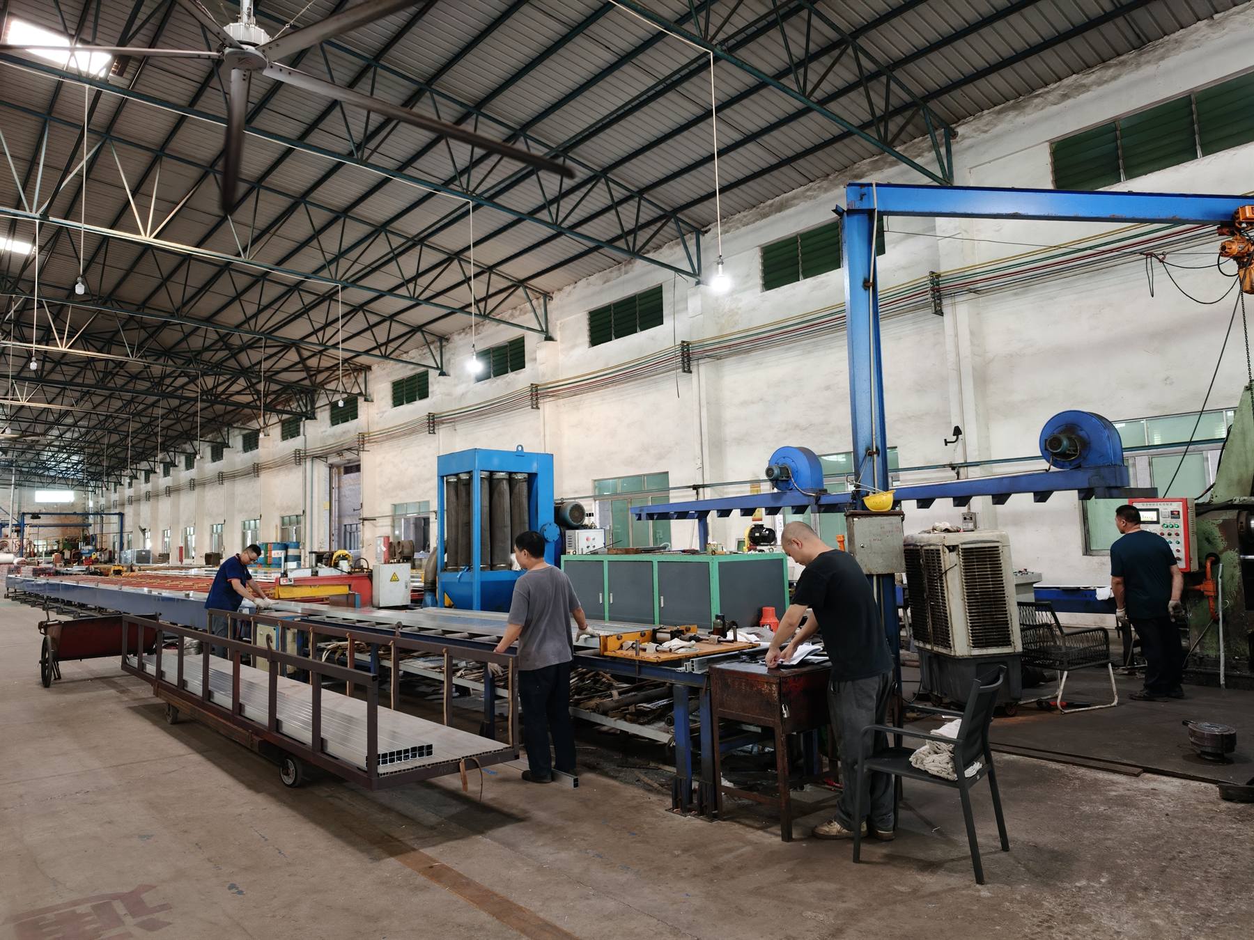 Operators working on the cutting and fabrication line
