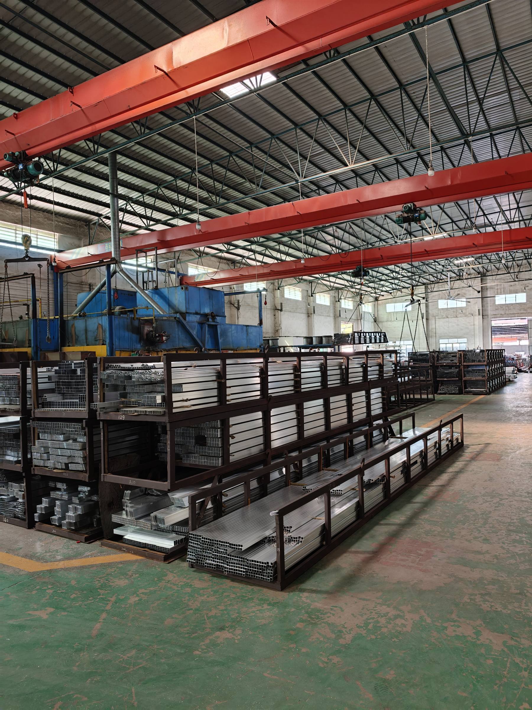Ageing ovens beside racks of finished profiles