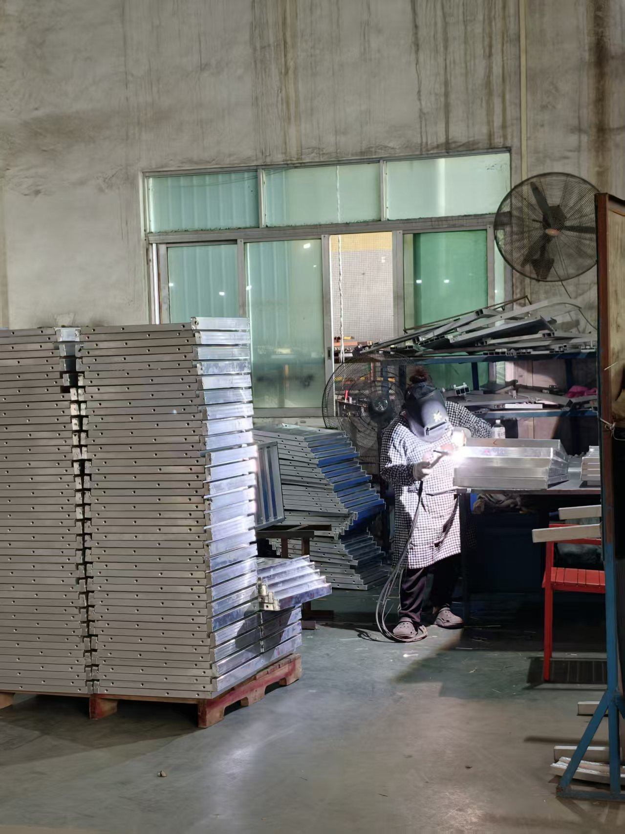 Welder joining an aluminum table frame on the fabrication line
